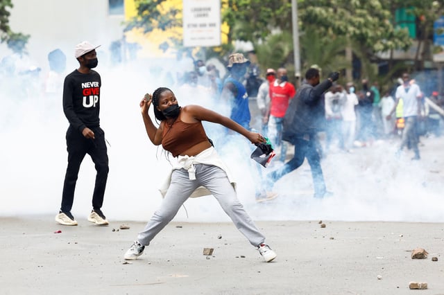 A protester throws a projectile during a demonstration over the death of Kenyan blogger Albert Ojwang in police custody, in downtown Nairobi, Kenya June 17, 2025. REUTERS/Thomas Mukoya