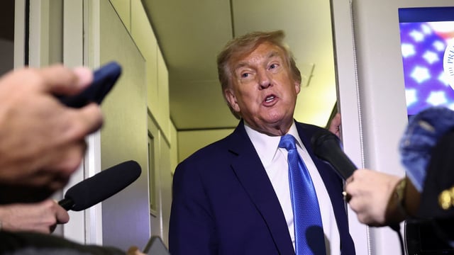 U.S. President Donald Trump speaks to reporters aboard Air Force One after departing early from the G7 summit in Canada to return to Washington, on June 17, 2025.