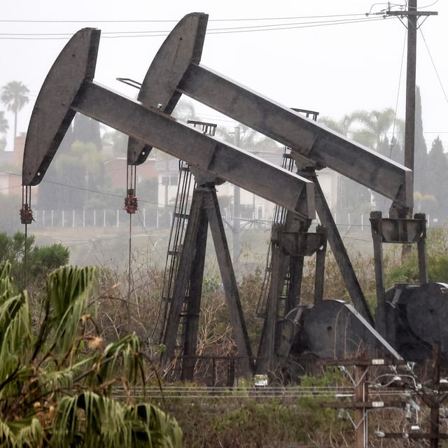 LOS ANGELES, CALIFORNIA - MARCH 28: An oil pumpjack (R) operates as another (C) stands idle on March 28, 2022 in Los Angeles, California. U.S. oil prices fell 7 percent to $105.96 per barrel while Brent crude lost 6.8 percent over demand concerns as China begins to implement a mass COVID-19 lockdown in Shanghai. (Photo by Mario Tama/Getty Images)
