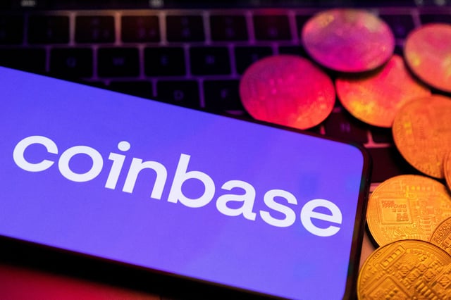 A smartphone with displayed Coinbase logo and representation of cryptocurrencies are placed on a keyboard in this illustration taken, June 8, 2023. REUTERS/Dado Ruvic/Illustration/File Photo