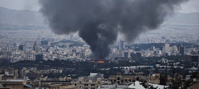 Smoke rises after a reported Israeli strike on a building used by Islamic Republic of Iran News Network, part of Iran&#39;s state TV broadcaster, on June 16, 2025 in Tehran, Iran.