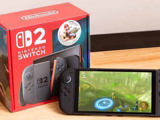 A Nintendo Switch 2 console next to its box