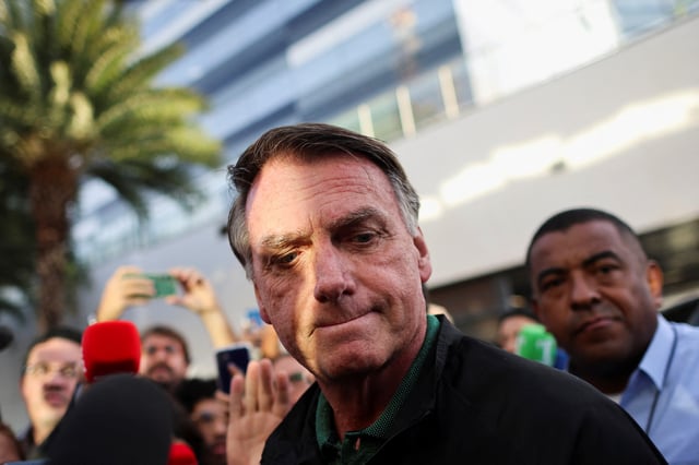 Former Brazilian President Jair Bolsonaro reacts as he leaves the Federal Police headquarters after testifying, in Brasilia, Brazil, June 5, 2025. REUTERS/Adriano Machado/File photo