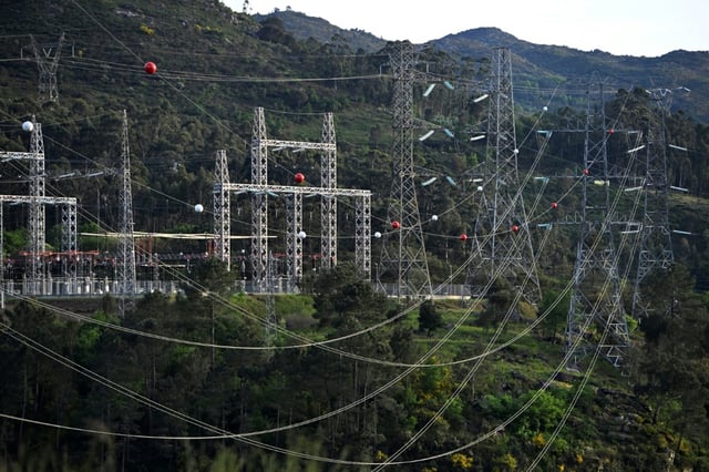 High-voltage transmission towers carrying electricity from Spain to Portugal are pictured near the border, in Lindoso, Portugal, on April 28, 2025
