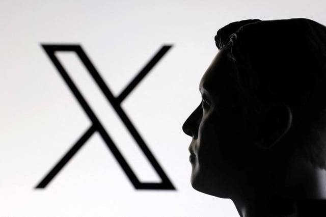 A 3D-printed miniature model of Elon Musk and the X logo are seen in this illustration taken January 23, 2025. REUTERS/Dado Ruvic/Illustration