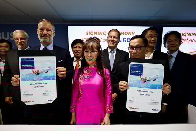 Vice President of commercial sales at Airbus SE Benoit de Saint-Exupery, Chief Executive Officer of commercial aircraft at Airbus SE Christian Scherer, Founder of Vietjet Air Nguyen Thi Phuong Thao and Dinh Viet Phuong, Chief Executive Officer of VietJet Air attend a press conference with Airbus SE at the Paris Air Show in Paris at the 55th International Paris Airshow at Le Bourget Airport near Paris, France, June 17, 2025. REUTERS/Benoit Tessier