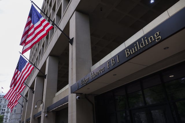 Flags hang outside of the J. Edgar Hoover Federal Bureau of Investigation (FBI) building on June, 2025 in Washington, DC.