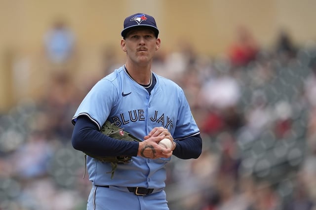 Toronto Blue Jays starting pitcher Bowden Francis (44) stands on the mound after issuing a walk to Minnesota Twins' Willi Castro (50) during the second inning of a baseball game Sunday, June 8, 2025, in Minneapolis. (AP Photo/Abbie Parr)