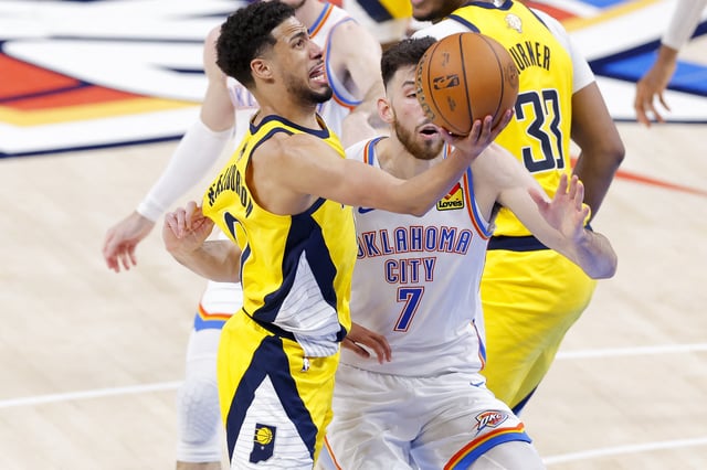 Jun 16, 2025; Oklahoma City, Oklahoma, USA; Indiana Pacers guard Tyrese Haliburton (0) drives to the basket past Oklahoma City Thunder forward Chet Holmgren (7) during the fourth quarter in game five of the 2025 NBA Finals at Paycom Center. Mandatory Credit: Alonzo Adams-Imagn Images
