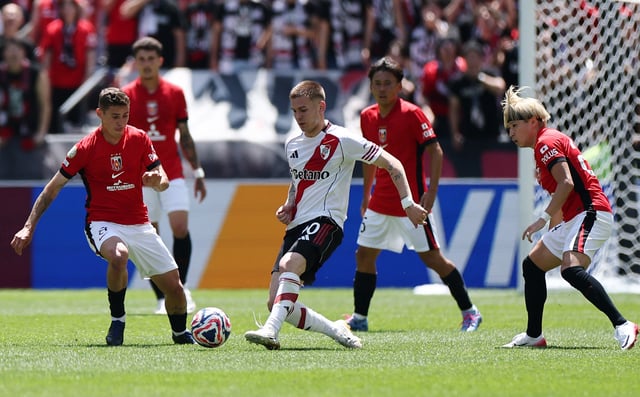 Soccer Football - FIFA Club World Cup - Group E - River Plate v Urawa Red Diamonds - Lumen Field, Seattle, Washington, U.S. - June 17, 2025 River Plate's Franco Mastantuono in action with Urawa Red Diamonds' Matheus Savio REUTERS/Agustin Marcarian