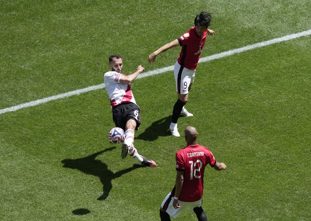 Soccer Football - FIFA Club World Cup - Group E - River Plate v Urawa Red Diamonds - Lumen Field, Seattle, Washington, U.S. - June 17, 2025  Urawa Red Diamonds' Thiago Santana and Urawa Red Diamonds' Genki Haraguchi in action with River Plate's German Pezzella IMAGN IMAGES via Reuters/Stephen Brashear
