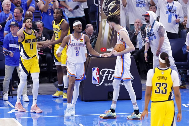 Jun 16, 2025; Oklahoma City, Oklahoma, USA; Oklahoma City Thunder guard Shai Gilgeous-Alexander (2) and forward Chet Holmgren (7) celebrate during the fourth quarter against the Indiana Pacers in game five of the 2025 NBA Finals at Paycom Center. Mandatory Credit: Alonzo Adams-Imagn Images