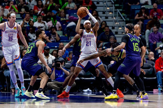 Apr 13, 2025; New Orleans, Louisiana, USA;  Oklahoma City Thunder guard Aaron Wiggins (21) looks to pass the ball over New Orleans Pelicans guard Jose Alvarado (15) during the second half at Smoothie King Center. Mandatory Credit: Stephen Lew-Imagn Images/File Photo