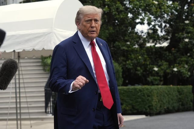 President Donald Trump walks to board Marine One after speakiing with reporters to depart the White House on his way to attend the G7 Summit in Canada, Sunday, June 15, 2025, in Washington. (AP Photo/Manuel Balce Ceneta)