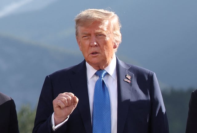 U.S. President Donald Trump gestures as he attends a family photo session during the G7 Summit, in Kananaskis, Alberta, Canada, June 16, 2025. REUTERS/Suzanne Plunkett/Pool/File Photo