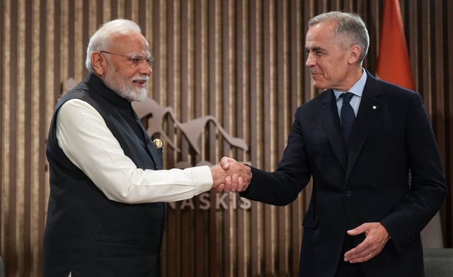 Indian Prime Minister Narendra Modi, left, and Canadian Prime Minister Mark Carney shake hands during a meeting at the G7 Summit in Kananaskis, Alta., on Tuesday, June 17, 2025. THE CANADIAN PRESS/Darryl Dyck