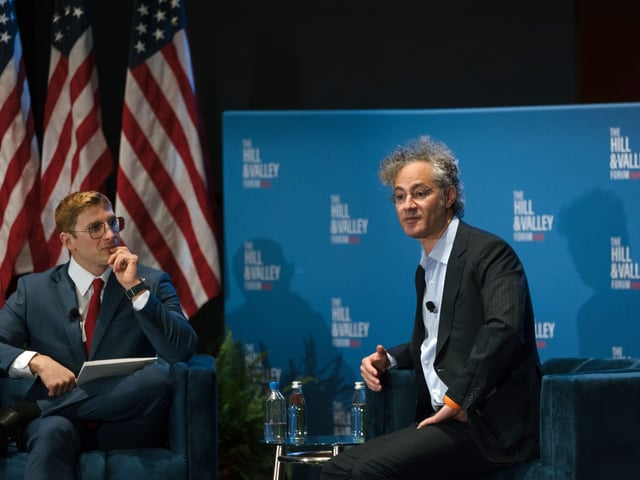 FILE Ñ Alex Karp, right, the chief executive of Palantir, speaks at a conference in Washington on April 30, 2025. Palantir is a data analysis and technology firm that has received more than $113 million in federal government spending since President Donald Trump took office in Jan.. (Caroline Gutman/The New York Times)