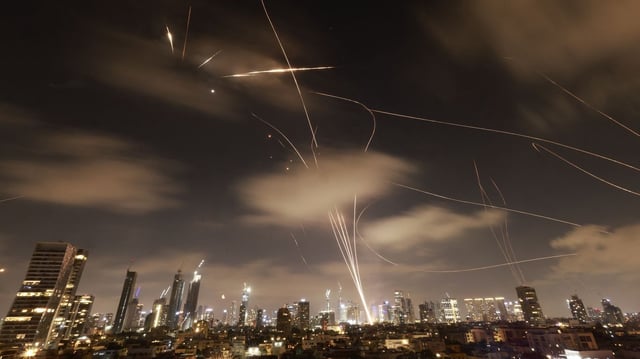 Israeli air defenses intercept Iranian missiles over Tel Aviv. Photo: Menahem Kahana/AFP via Getty Images