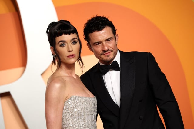 US singer Katy Perry (L) and English actor Orlando Bloom attend the Vanity Fair Oscar Party at the Wallis Annenberg Center for the Performing Arts in Beverly Hills, California, on March 2, 2025.  (Photo by MICHAEL TRAN/AFP via Getty Images)