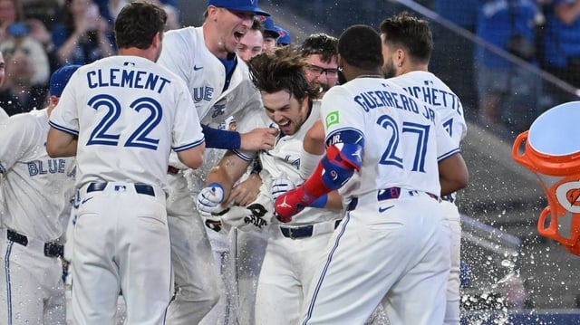 Jun 17, 2025; Toronto, Ontario, CAN;   Toronto Blue Jays right fielder Addison Barger (47, center) celebrates with team mates after hitting a walk off solo home run against the Arizona Diamondbacks in the ninth inning at Rogers Centre. Mandatory Credit: Dan Hamilton-Imagn Images