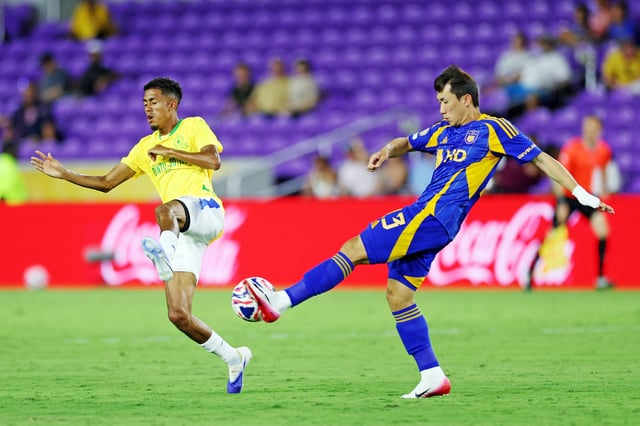 Jun 17, 2025; Orlando, Florida, USA; Ulsan HD defender Sangwoo Kang (13) controls the ball as Mamelodi Sundowns FC forward Tashreeq Matthews (17) defends during the second half during a group stage match of the 2025 FIFA Club World Cup at Inter&Co Stadium. Mandatory Credit: Nathan Ray Seebeck-Imagn Images