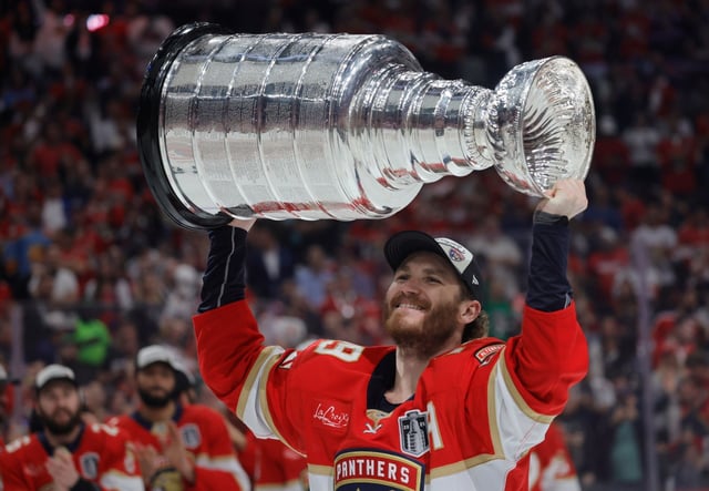 Florida Panthers left wing Matthew Tkachuk (19) skates with the Stanley Cup after Game 6 of the Stanley Cup Final, Tuesday, June 17, 2025, at Amerant Bank Arena in Sunrise, Fla. (Joe Cavaretta/South Florida Sun Sentinel)