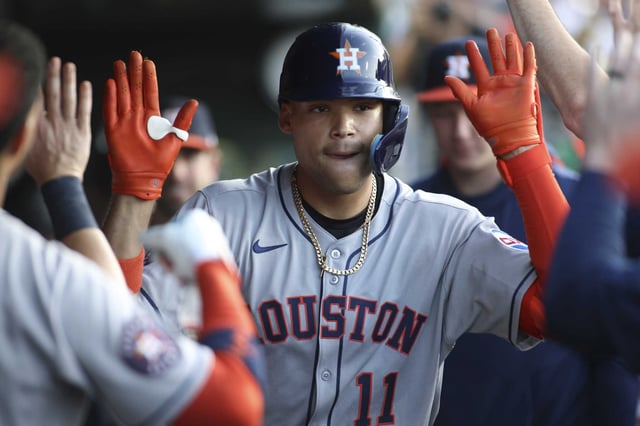 Cam Smith led the way with two homers as part of a four-hit game as the Houston Astros shellacked Athletics pitching to even their series at a game apiece.