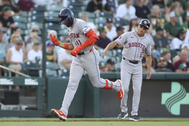 Houston Astros&#39; Cam Smith (11) gestures after rounding third base after hitting a solo home run against the Athletics during the second inning of a baseball game Tuesday, June 17, 2025, in West Sacramento, Calif. (AP Photo/Scott Marshall)