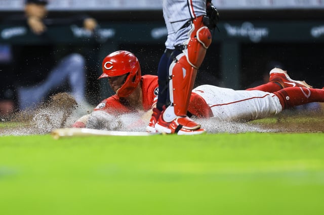 Jun 17, 2025; Cincinnati, Ohio, USA; Cincinnati Reds second baseman Matt McLain (9) scores on a two-run double hit by outfielder TJ Friedl (not pictured) in the sixth inning against the Minnesota Twins at Great American Ball Park. Mandatory Credit: Katie Stratman-Imagn Images