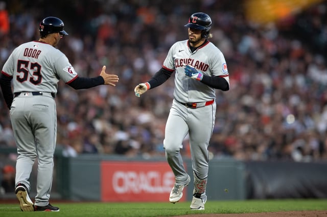 Jun 17, 2025; San Francisco, California, USA; Cleveland Guardians shortstop Gabriel Arias (13) (right) gets a congratulatory handshake from third base coach Rouglas Odor (53) after hitting a solo home run against the San Francisco Giants during the sixth inning at Oracle Park. Mandatory Credit: D. Ross Cameron-Imagn Images