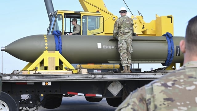Airmen look at a GBU-57, or the Massive Ordnance Penetrator bomb, at Whiteman Air Base in Missouri.