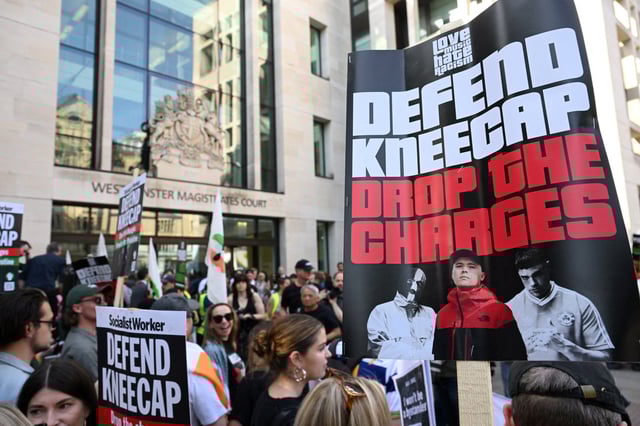 Protesters gather outside Westminster Magistrates' Court, on the day of the appearance of Kneecap member Liam O'Hanna, also known as Liam Og O hAnnaidh and performing under the name of Mo Chara, who has been charged with a terrorism offence in relation to the alleged display of a Hezbollah flag onstage in 2024, in London, Britain, June 18, 2025. REUTERS/Jaimi Joy