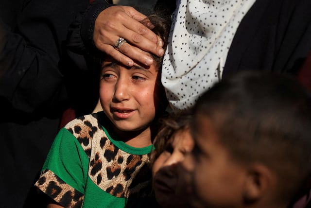 A mourner reacts during the funeral of Palestinians killed on Tuesday by Israeli fire while seeking aid in northern Gaza, according to Gaza's health ministry, at Al-Shifa Hospital, in Gaza City, June 18, 2025. REUTERS/Dawoud Abu Alkas