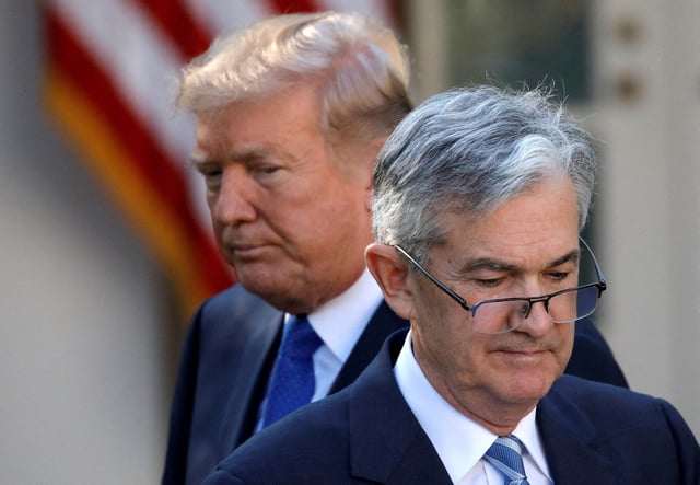 U.S. President Donald Trump looks on as Jerome Powell, his nominee to lead the U.S. Federal Reserve moves to the podium at the White House in Washington, U.S., November 2, 2017. REUTERS/Carlos Barria/File Photo