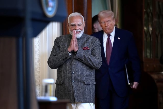 U.S. President Donald Trump (R) and Indian Prime Minister Narendra Modi arrive for a joint press conference in the East Room at the White House on February 13, 2025 in Washington, DC.