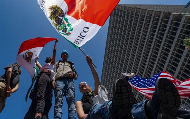 Thousands of people gather on No Kings Day to protest Trump, his administration, and ICE activities in Los Angeles, California.