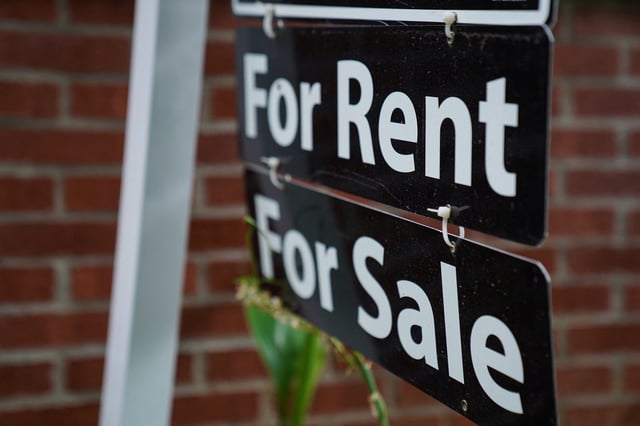 A "For Rent, For Sale" sign is seen outside of a home in Washington, U.S., July 7, 2022. REUTERS/Sarah Silbiger/ File Photo