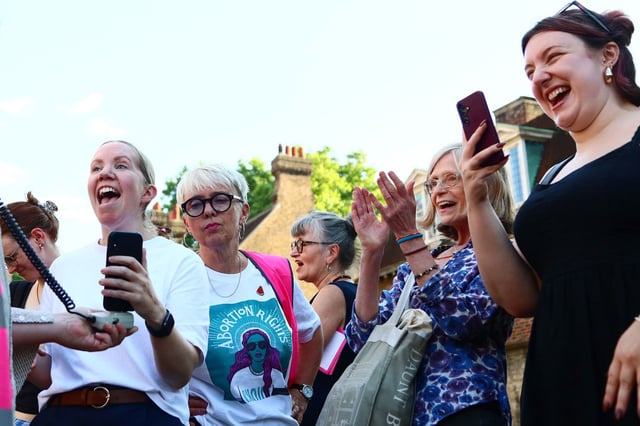LONDON, ENGLAND - JUNE 17: Protesters from pro-choice group 'Abortion Rights' react as they gather near Parliament, after MPs voted to decriminalise abortion on June 17, 2025 in London, United Kingdom. In a free vote held in Parliament on Tuesday, MP's were considering two separate amendments to the Crime and Policing Bill, brought forward by Labour MPs Tonia Antoniazzi and Stella Creasey, which both seek to decriminalise abortion in England and Wales. Although abortion is allowed up to 24 weeks under certain criteria laid out in the 1967 Abortion Act, women can still be prosecuted for terminating pregnancies under the Victorian-era 'Offences Against the Person Act' which makes it a crime for a woman to "procure her own miscarriage." (Photo by Alishia Abodunde/Getty Images)
