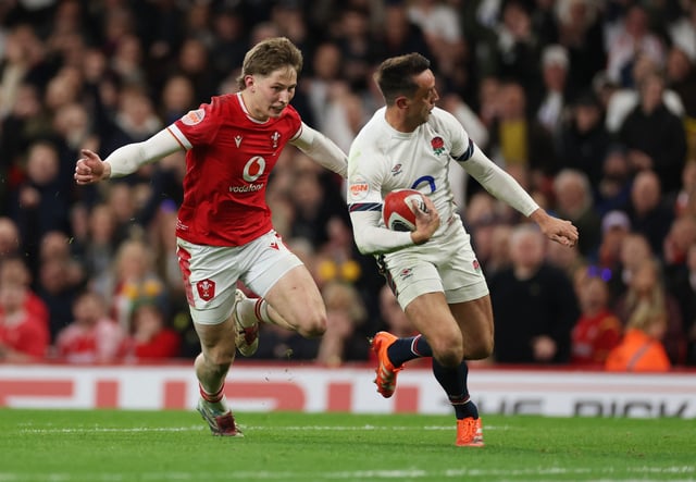 Rugby Union - Six Nations Championship - Wales v England - Millennium Stadium, Cardiff, Wales, Britain - March 15, 2025 England's Alex Mitchell scores their sixth try as Wales' Ellis Mee attempts to make a tackle REUTERS/Ian Walton