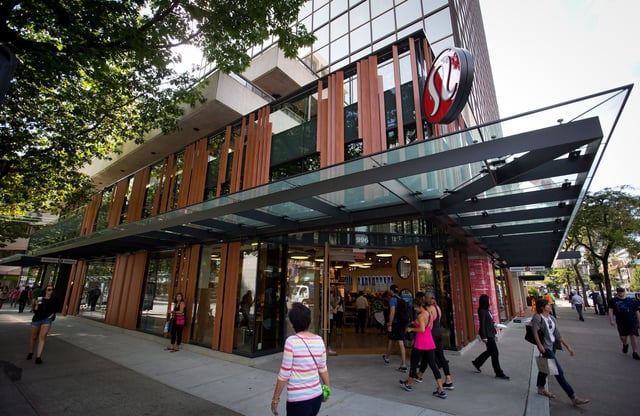 Shoppers enter Lululemon Athletica's flagship store on Robson Street during it's grand opening in downtown Vancouver, B.C., on Thursday Aug. 21, 2014. THE CANADIAN PRESS/Darryl Dyck