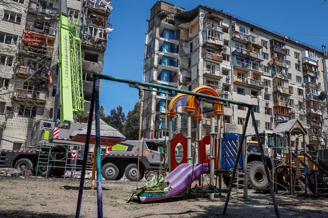 View shows an apartment building damaged on Tuesday during Russian drone and missile strikes, where locals brought flowers to mourn, amid Russia's attack on Ukraine, in Kyiv, Ukraine, June 18, 2025. REUTERS/Alina Smutko