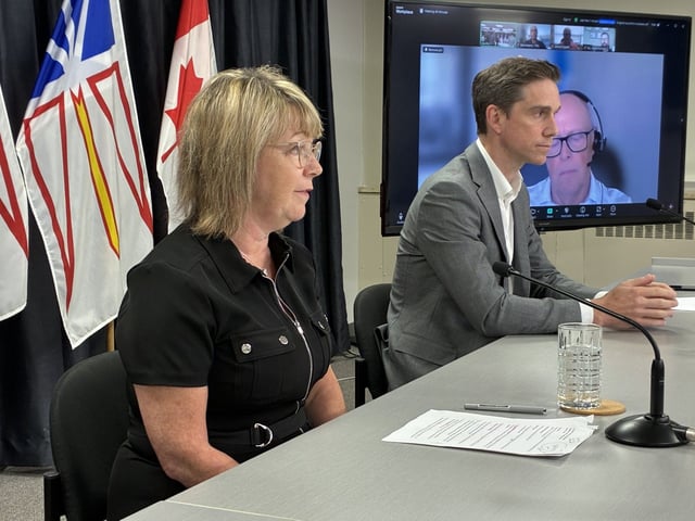 Premier John Hogan, right, announced the evacuation of Badger June 18 as a wildfire threatens the town