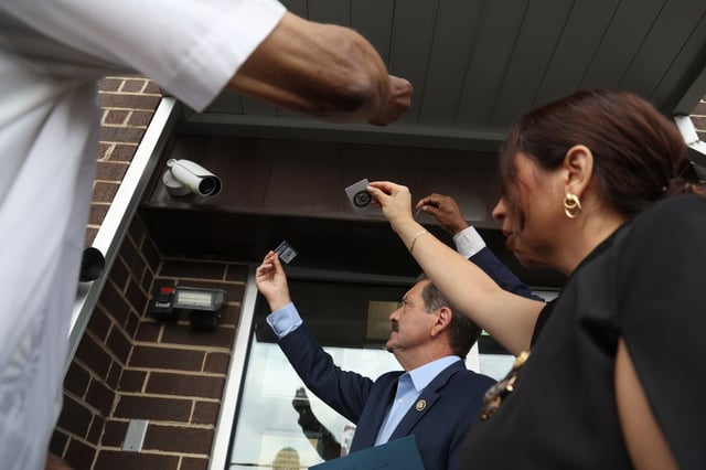 Illinois Reps. Danny K. Davis, Jesús “Chuy” Garcia, Delia C. Ramirez and Jonathan Jackson show their identification to a security camera as they attempt entry into the U.S. Immigration and Enforcement processing center in Broadview, June 18, 2025. The was told they needed to make a request first with ICE. (Antonio Perez/Chicago Tribune)