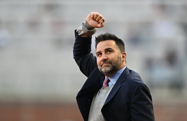 ATLANTA, GA - APRIL 09: Alex Anthopoulos of the Atlanta Braves aknowledges the crowd at Truist Park during the World Series Ring Ceremony on April 9, 2022 in Atlanta, Georgia.