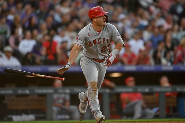 DENVER, CO - JUNE 24: Mike Trout #27 of the Los Angeles Angels watches the flight of a third inning solo homerun in a game against the Colorado Rockies at Coors Field on June 24, 2023 in Denver, Colorado.