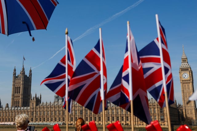 A general view of Union Jack flags and the Houses of Parliament in London, Britain, April 12, 2025. REUTERS/Carlos Jasso/ File Photo