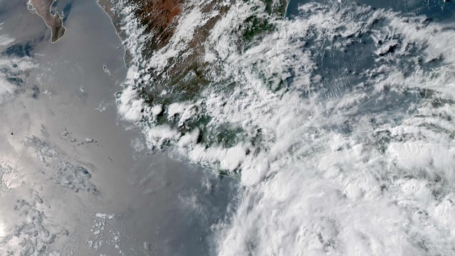 This handout satellite image obtained from the National Oceanic and Atmospheric Administration (NOAA)/GOES shows Tropical Storm Erick over southern Mexico on June 17, 2025. 