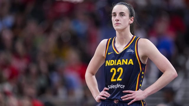 Indiana Fever guard Caitlin Clark (22) plays against the Dallas Wings in the second half of a WNBA basketball game in Indianapolis, Sunday, Sept. 15, 2024. (AP Photo/Michael Conroy)