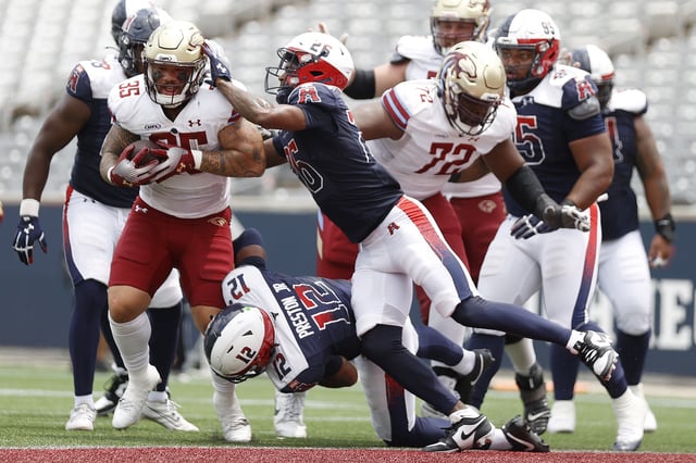 HOUSTON, TEXAS - MAY 17: Toa Taua #35 of the Michigan Panthers runs against Damon Arnette #26 of the Houston Roughnecks during the third quarter at TDECU Stadium on May 17, 2025 in Houston, Texas.