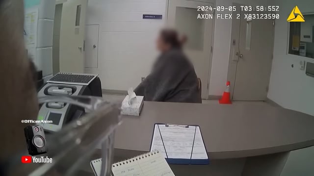 A screengrab from a videotaped interview with an officer dated September 4, 2024, shows the 44-year-old woman being questioned after an arrest for allegedly driving under the influence of prescription medicine. Bodycam video was posted to a YouTube channel last year, but only recently gained attention after her reference to the Moscow murders was noticed.The woman’s name, which CNN is not publishing because she has not been named in court documents in the Kohberger case and has not publicly identified herself, matches initials listed in court documents for a DoorDash driver who made a delivery to Kernodle early on the morning of November 13, 2022. A portion of this image has been blurred by CNN to protect the individual's identity.